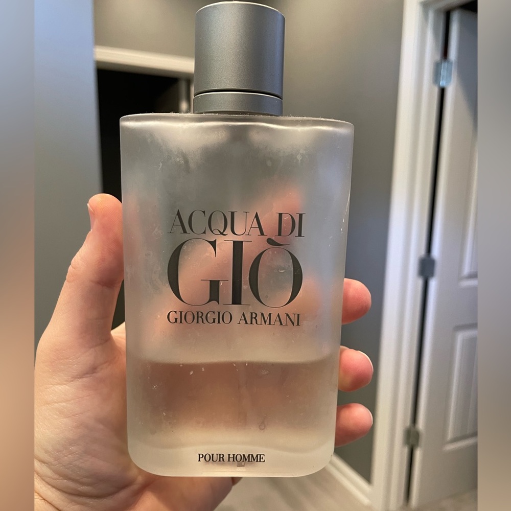 Acqua di gio cologne by Giorgio Armani - 6.7 ounce bottle. Less than half full!